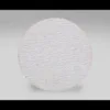 Round textured white object on gray background.