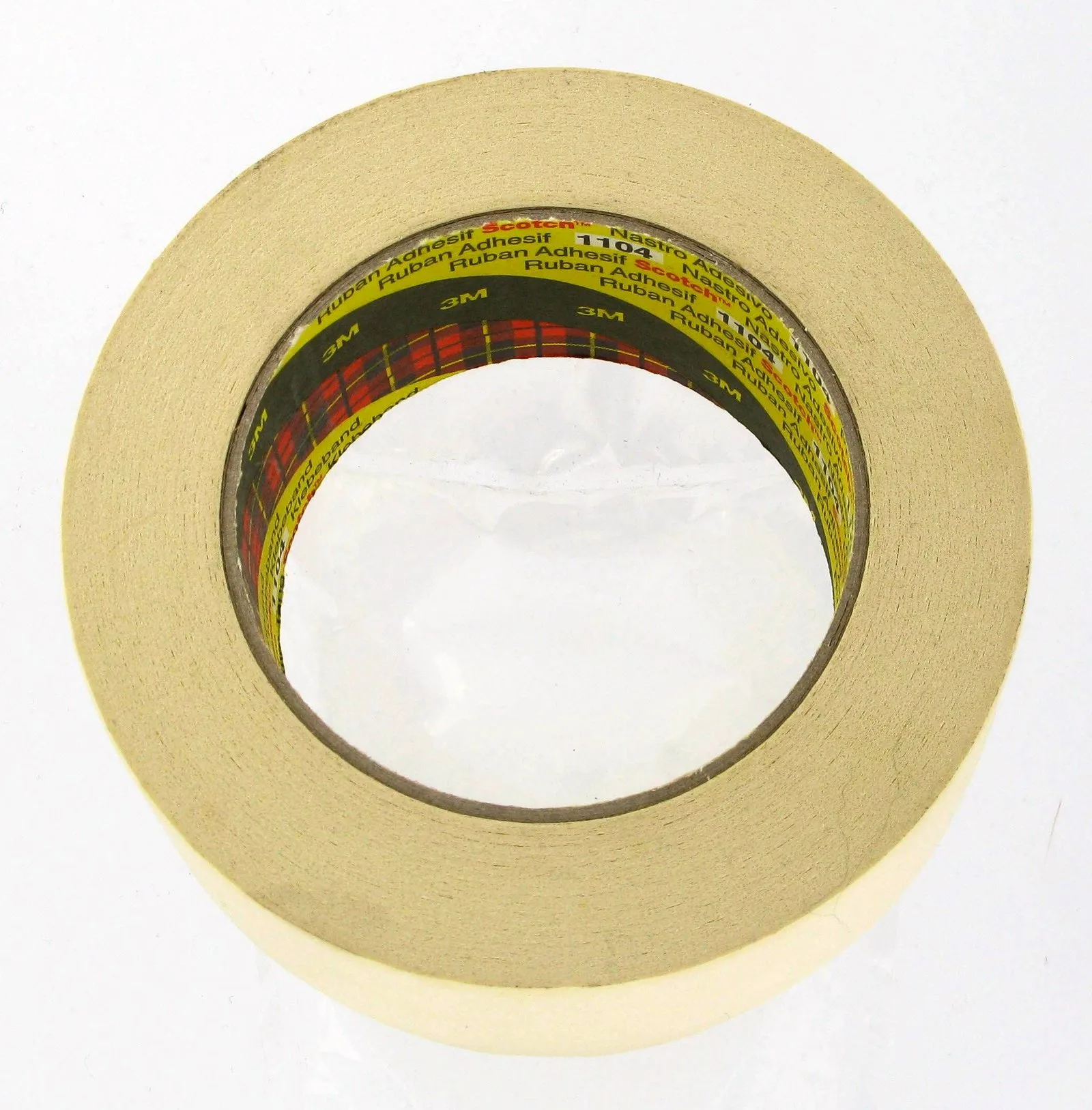 Roll of beige adhesive tape on white background.