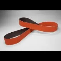 Two orange sanding belts on gray background