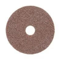 Brown circular floor polishing pad with center hole.