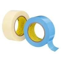 Two rolls of masking tape, blue and white.