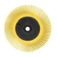 Yellow bristle brush with circular shape for cleaning.