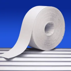 Large industrial paper roll on blue background