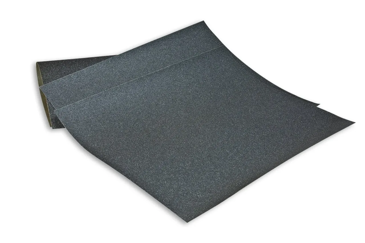 Black sandpaper sheets on white background.