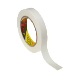Roll of white adhesive tape unraveling