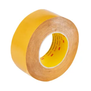 Yellow adhesive tape roll on white background.