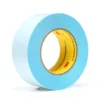 Blue adhesive tape roll isolated on white background.