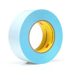 Blue adhesive tape roll isolated on white background.