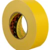Yellow adhesive tape roll on white background.