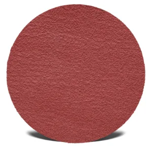 Red textured sanding disc for woodworking.