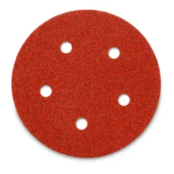 Round red sandpaper disc with five holes.