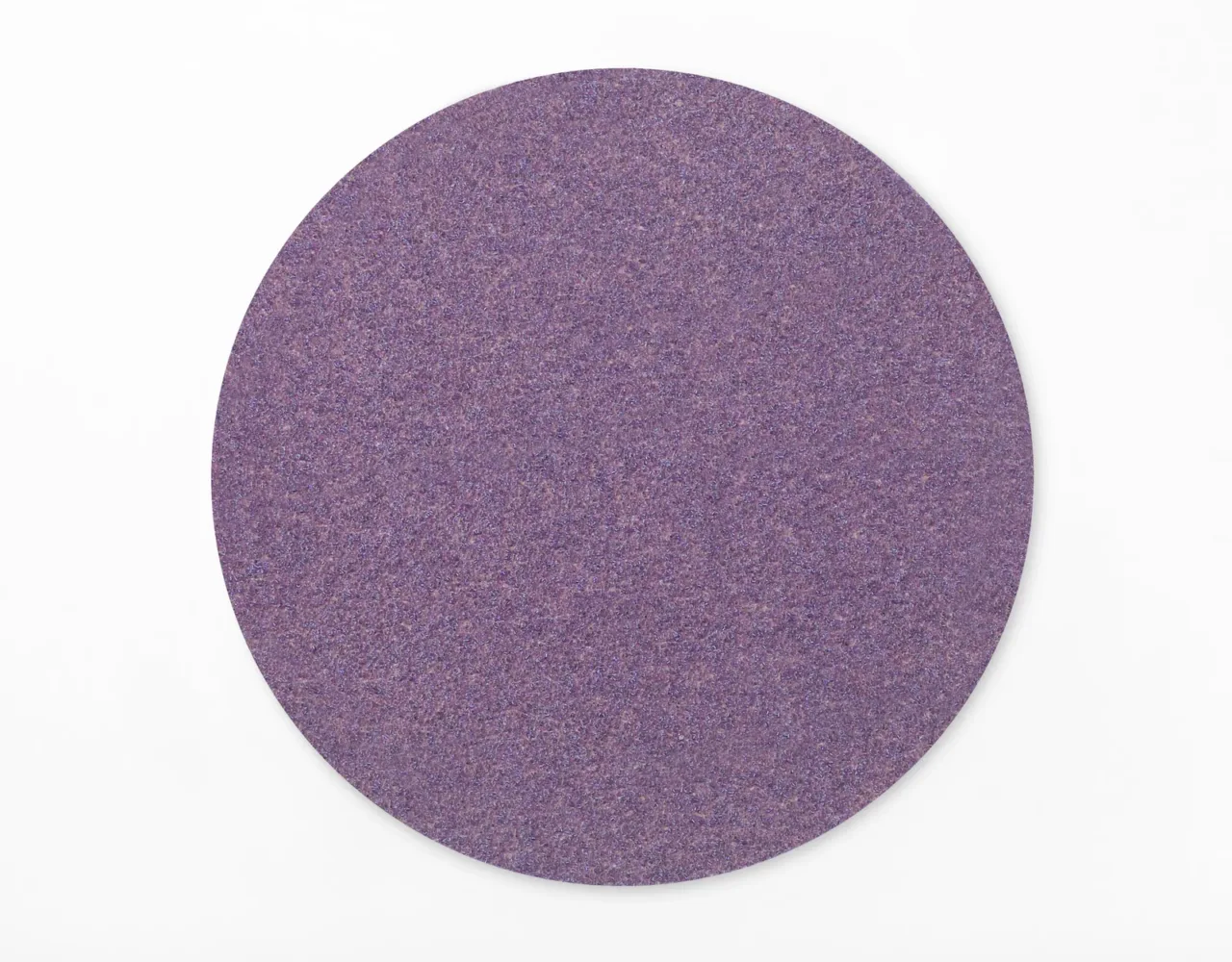 Purple circular sandpaper disc on white background
