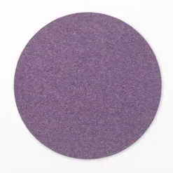 Purple circular sandpaper disc on white background
