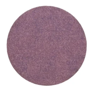 Purple abrasive sanding disc on white background.
