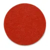 Red abrasive disc on white background