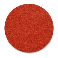 Red abrasive sanding disk close-up.