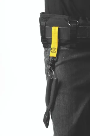 Utility belt with tool attached via yellow strap