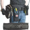 Person wearing tool belt with various tools.