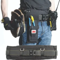 Person wearing tool belt with various tools.