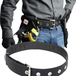 Worker wearing safety belt with tools attached.