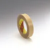 Brown masking tape roll on white background.