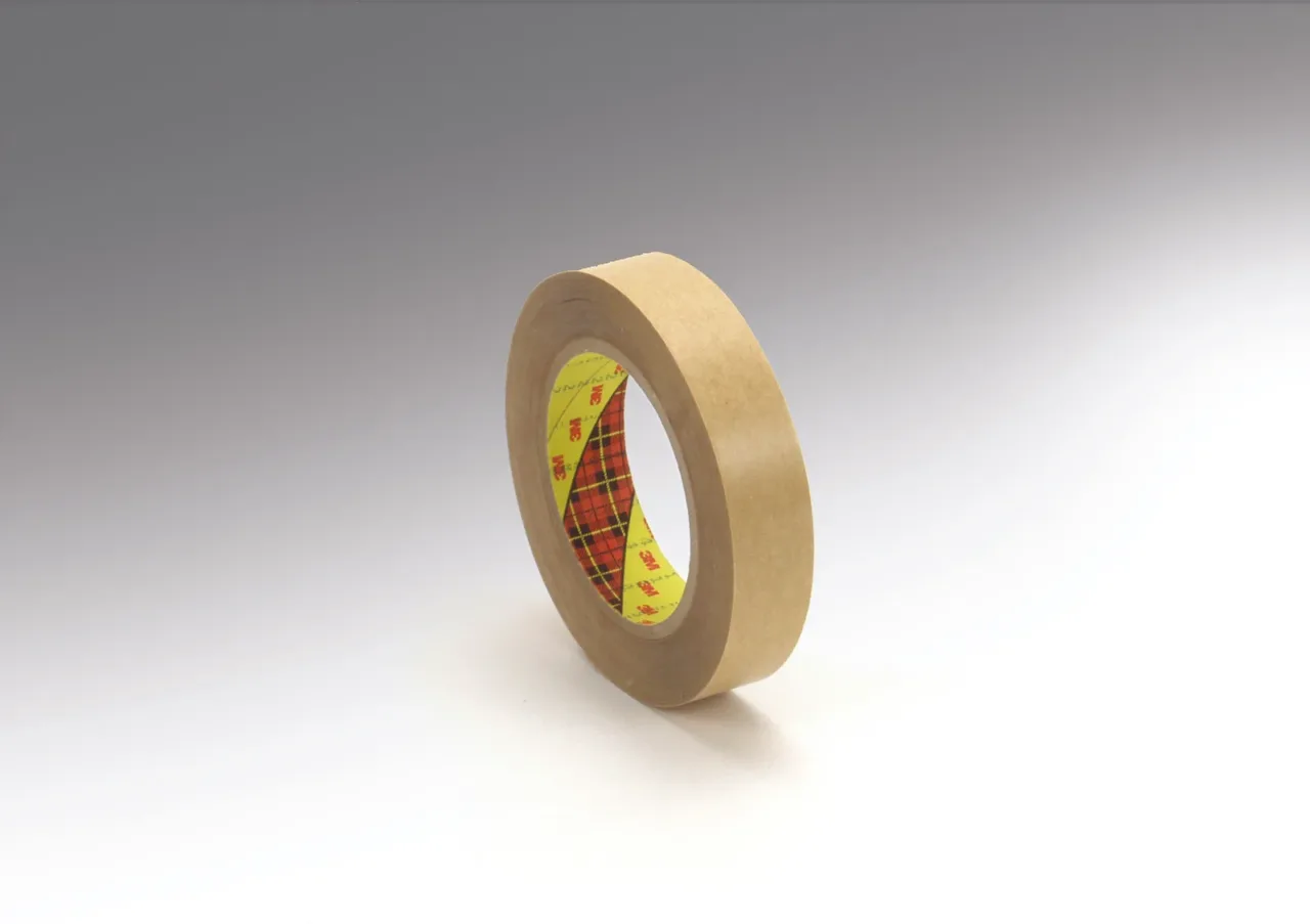 Brown masking tape roll on white background.