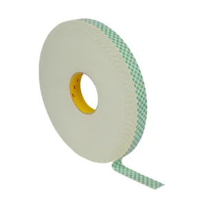 Roll of adhesive tape with green checks