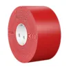 Red adhesive tape roll, side view.
