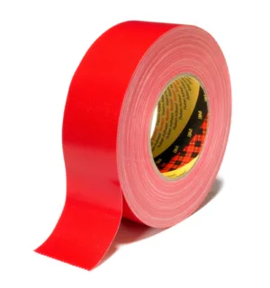 Red adhesive tape roll on white background.