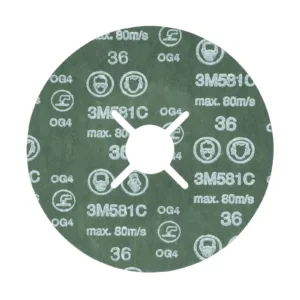 Green abrasive disc for industrial use, 3M branding visible.