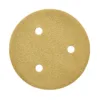 Round sandpaper disc with three holes, close-up.