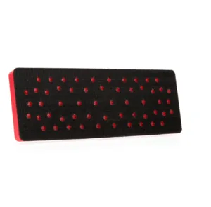 Rectangular vented black shoe pad with red border.