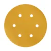 Round sandpaper disc with six holes.