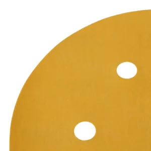 Close-up of round sandpaper with holes