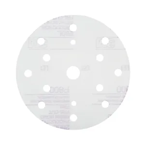 Round sanding disc with multiple holes.
