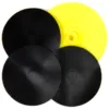 Black and yellow round plastic discs stack.