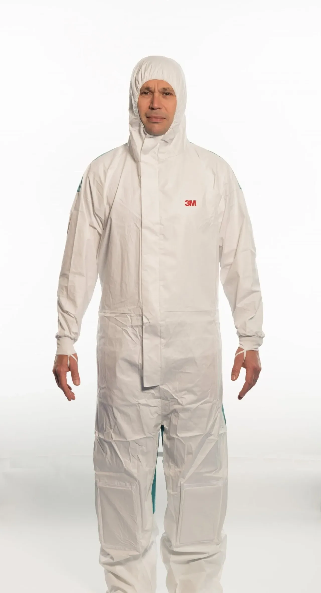 Person wearing white protective coverall suit