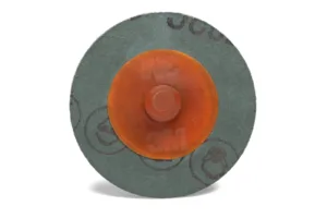 Round abrasive disc with orange center, 3M branding.