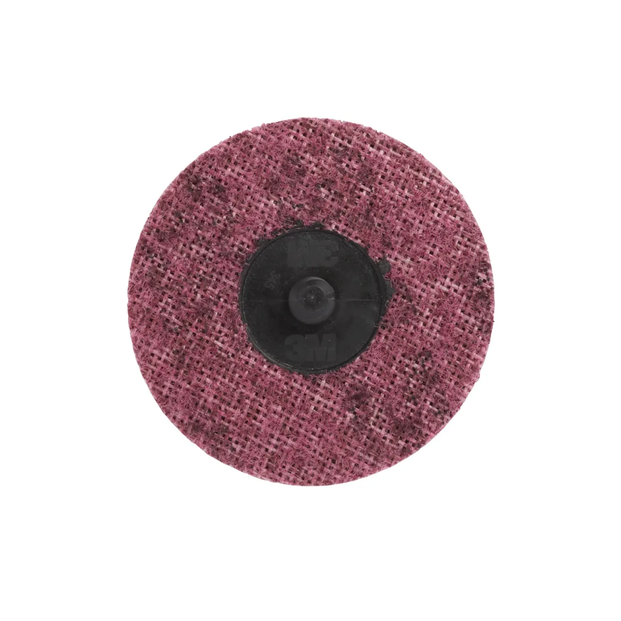 Grinding wheel with a textured pink surface.