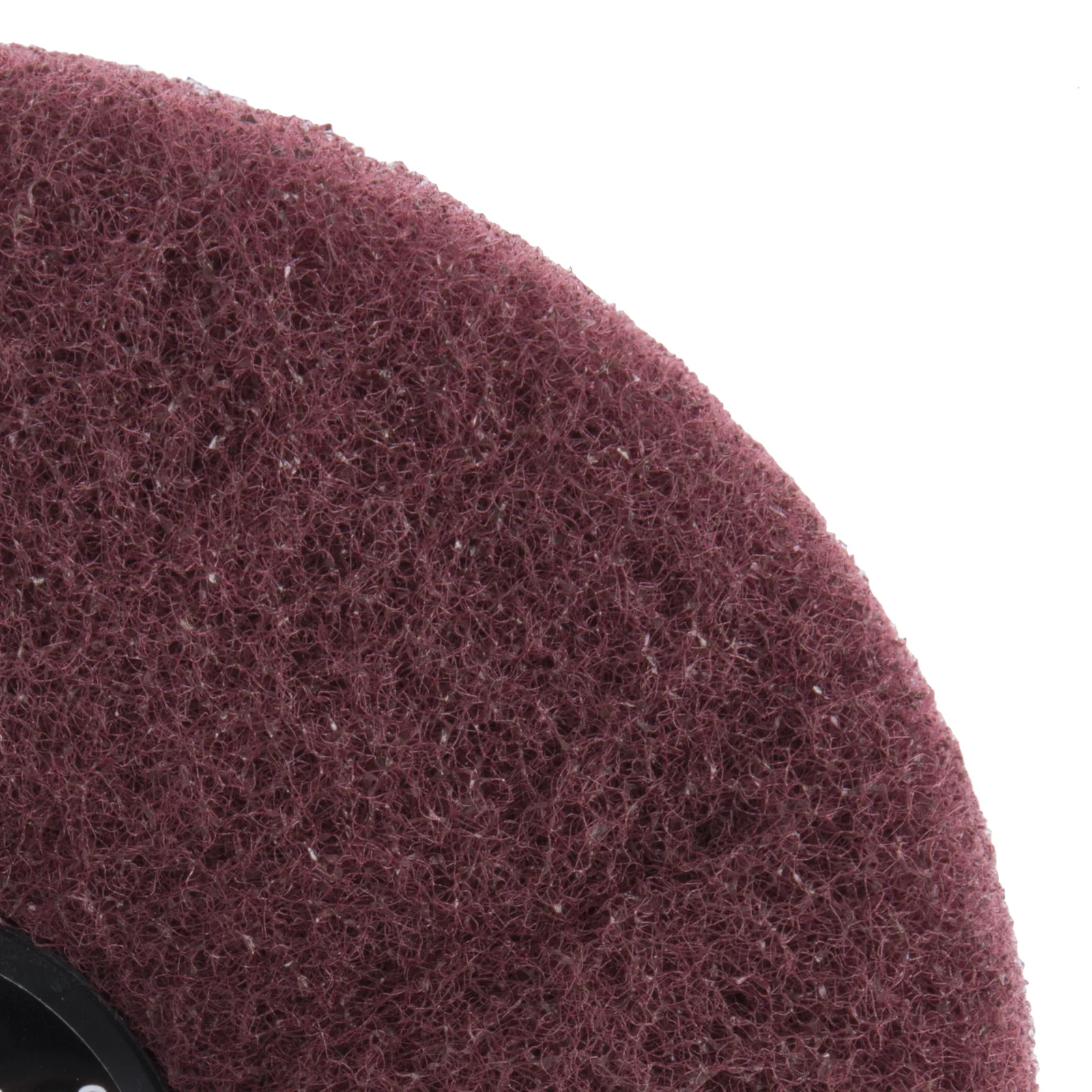 Close-up of maroon abrasive pad texture.