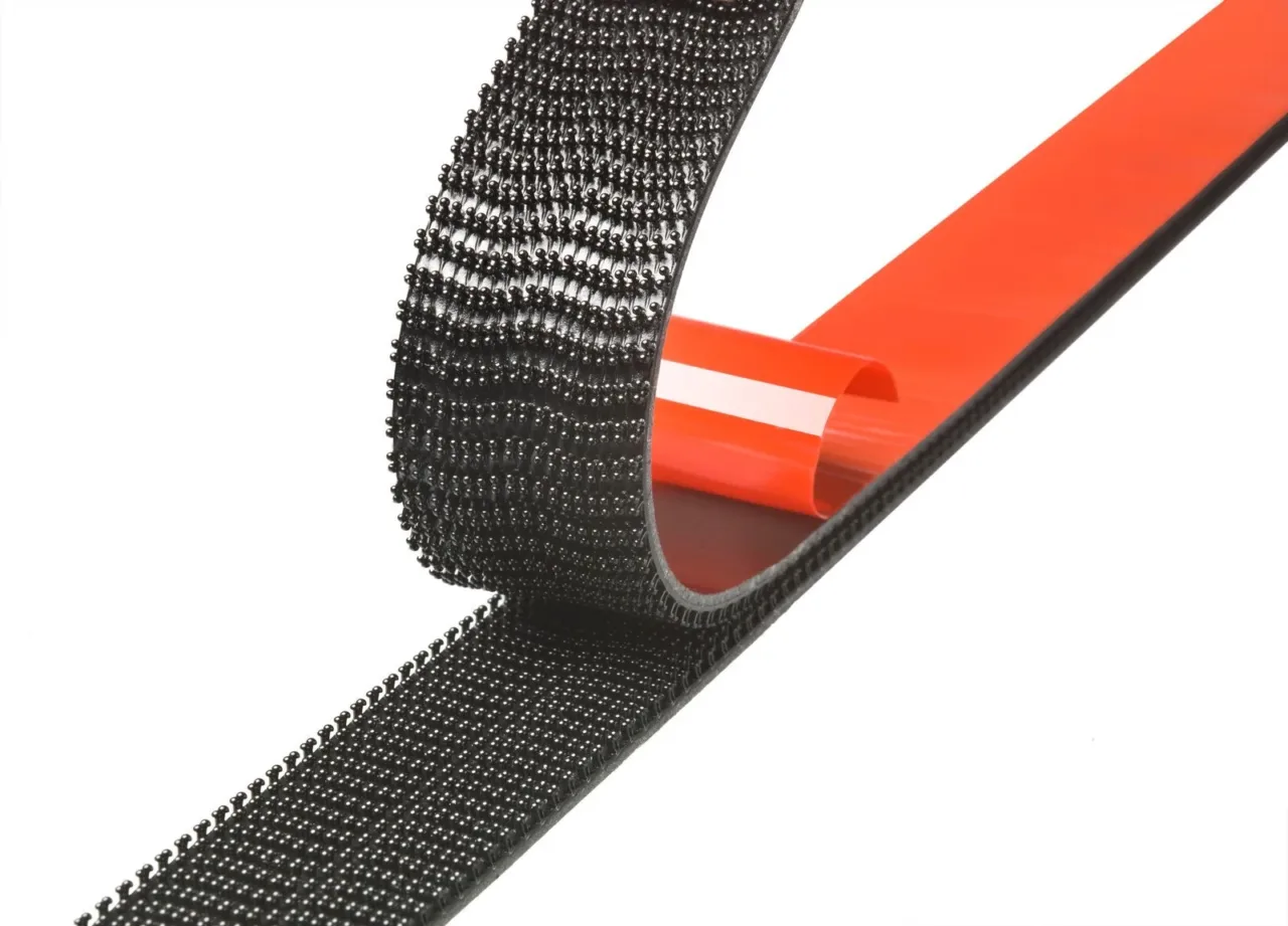 Black hook-and-loop tape with adhesive backing