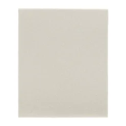 Rectangular white sponge for cleaning surfaces.