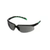 Black and green sports sunglasses on white background.