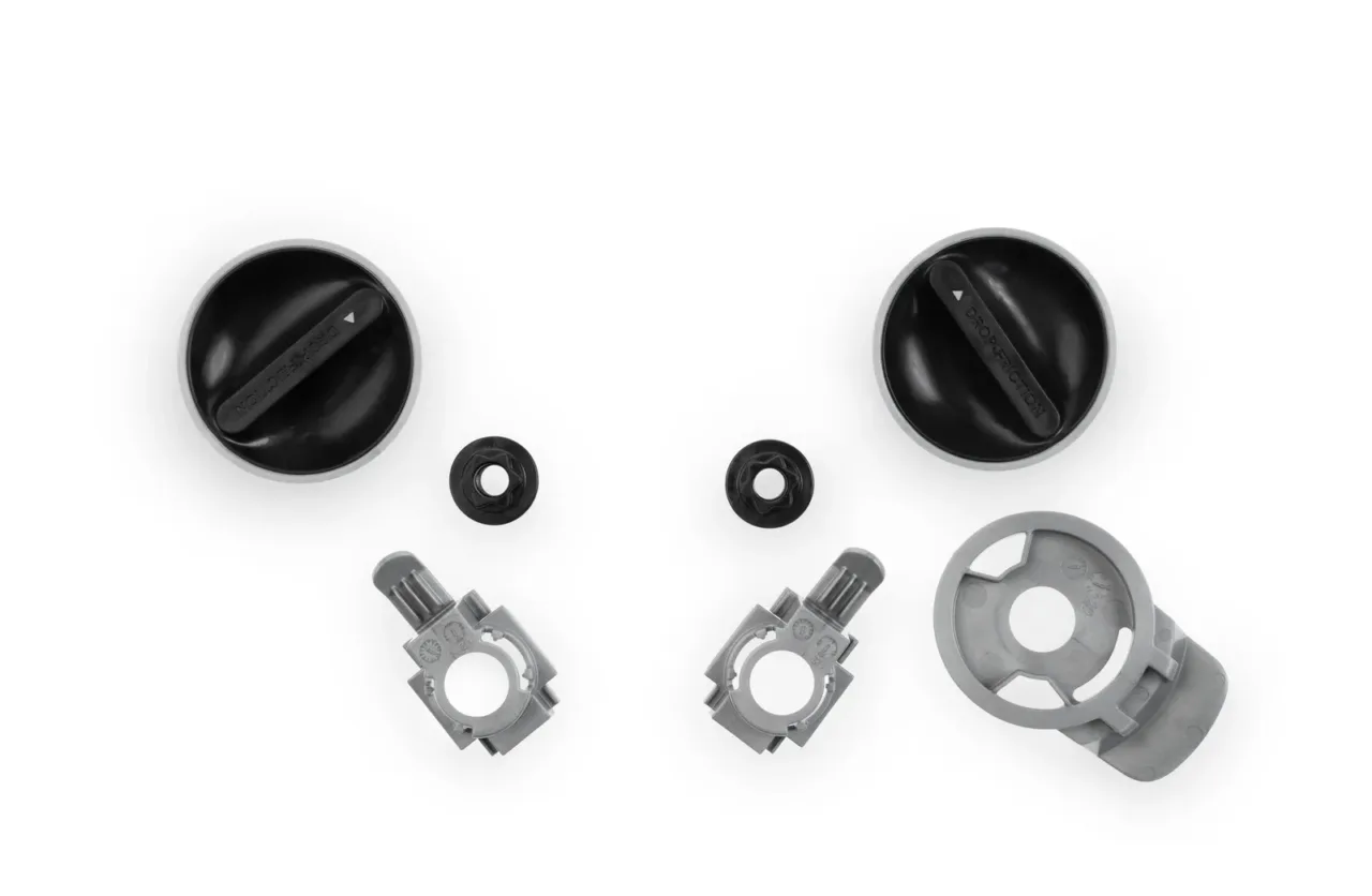 Black and gray plastic oven knobs and adapters