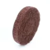 Brown abrasive cleaning pad on white background.