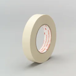 Roll of masking tape on gray background.
