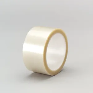 Clear adhesive tape roll on gray background.