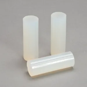 Three translucent silicone rods on gray background