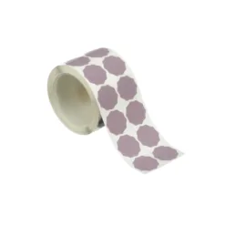 Purple adhesive labels on sticker roll