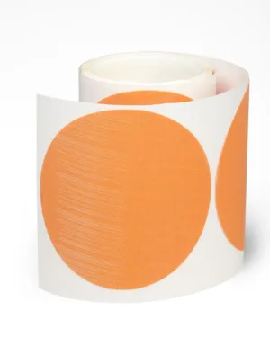 Roll of orange circular stickers